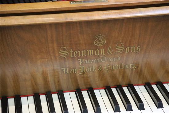 A Steinway & Sons figured walnut boudoir grand piano, W.4ft 8in. L.5ft 10in.